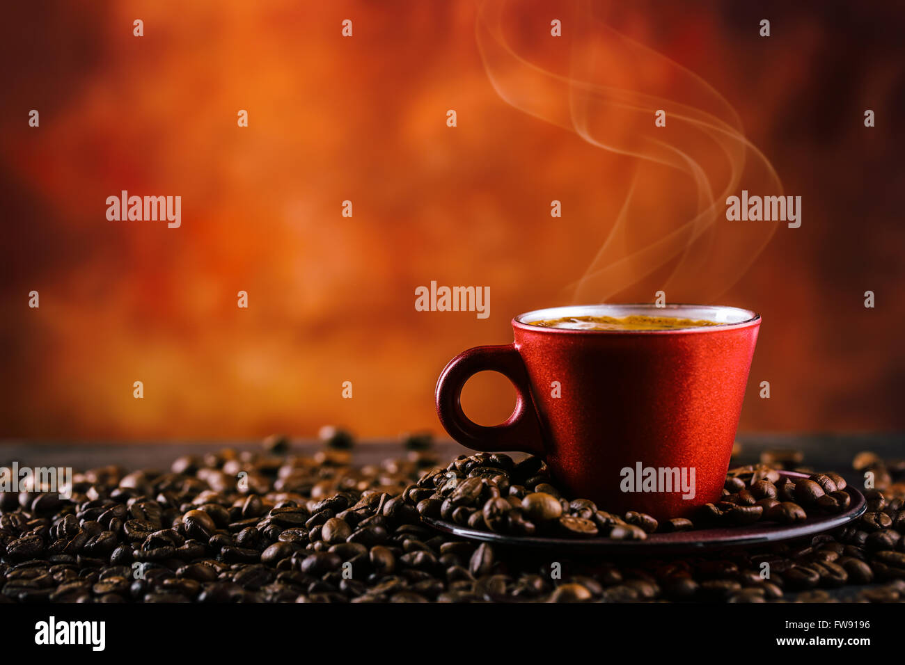 Coffee. Cup of black coffee and spilled coffee beans. Coffee break. Stock Photo
