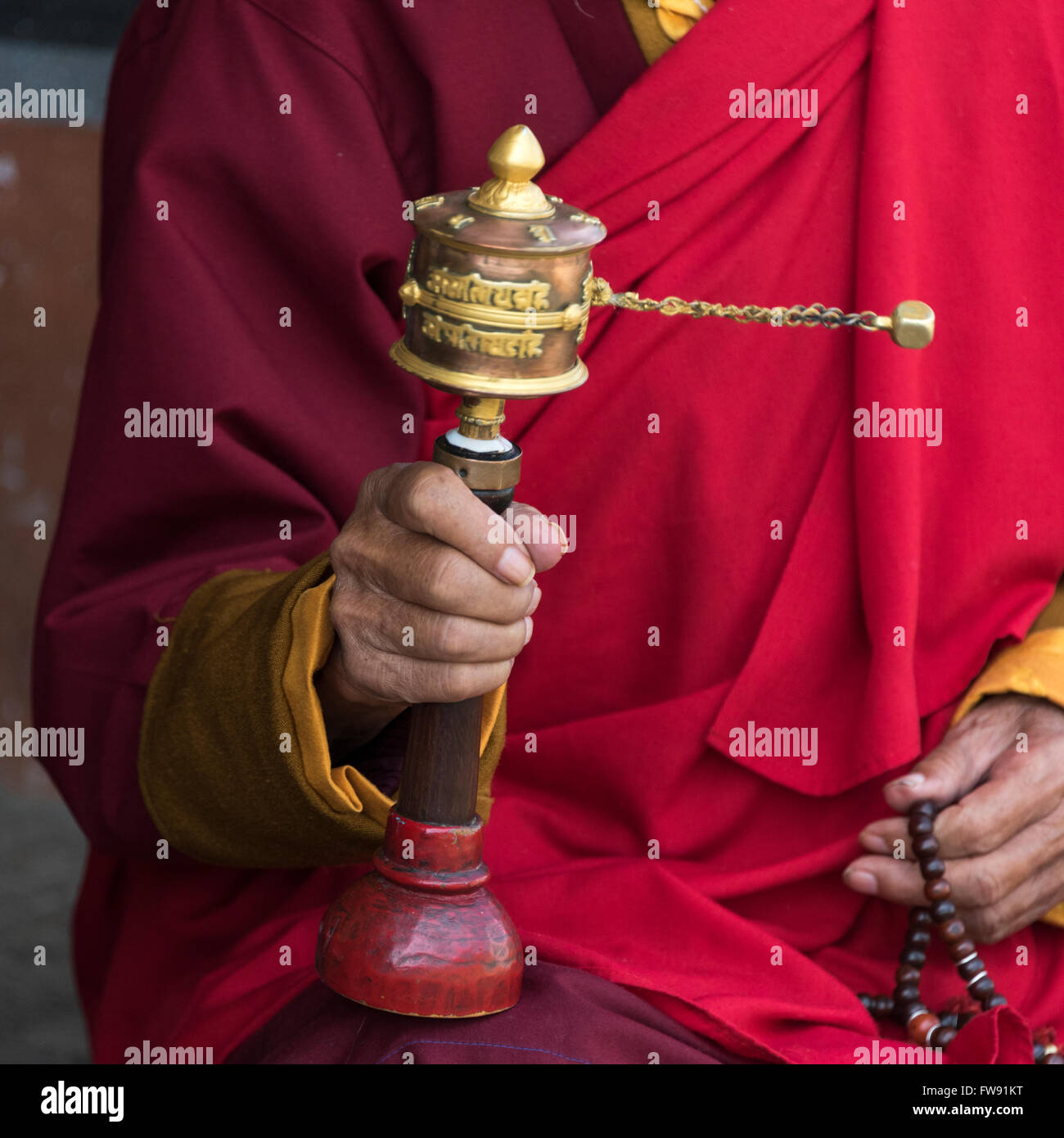 Buddhist monk holding prayer wheel hi-res stock photography and images ...