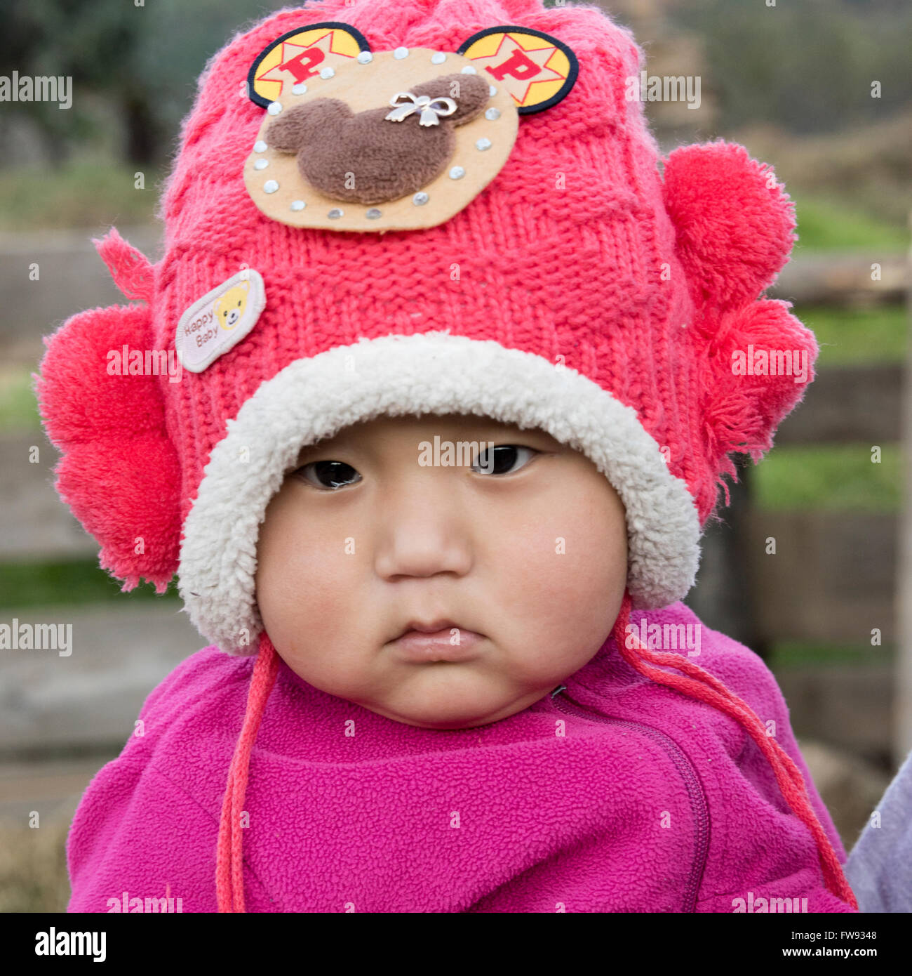 Portrait of a toddler wearing a knit hat, Paro, Bhutan Stock Photo
