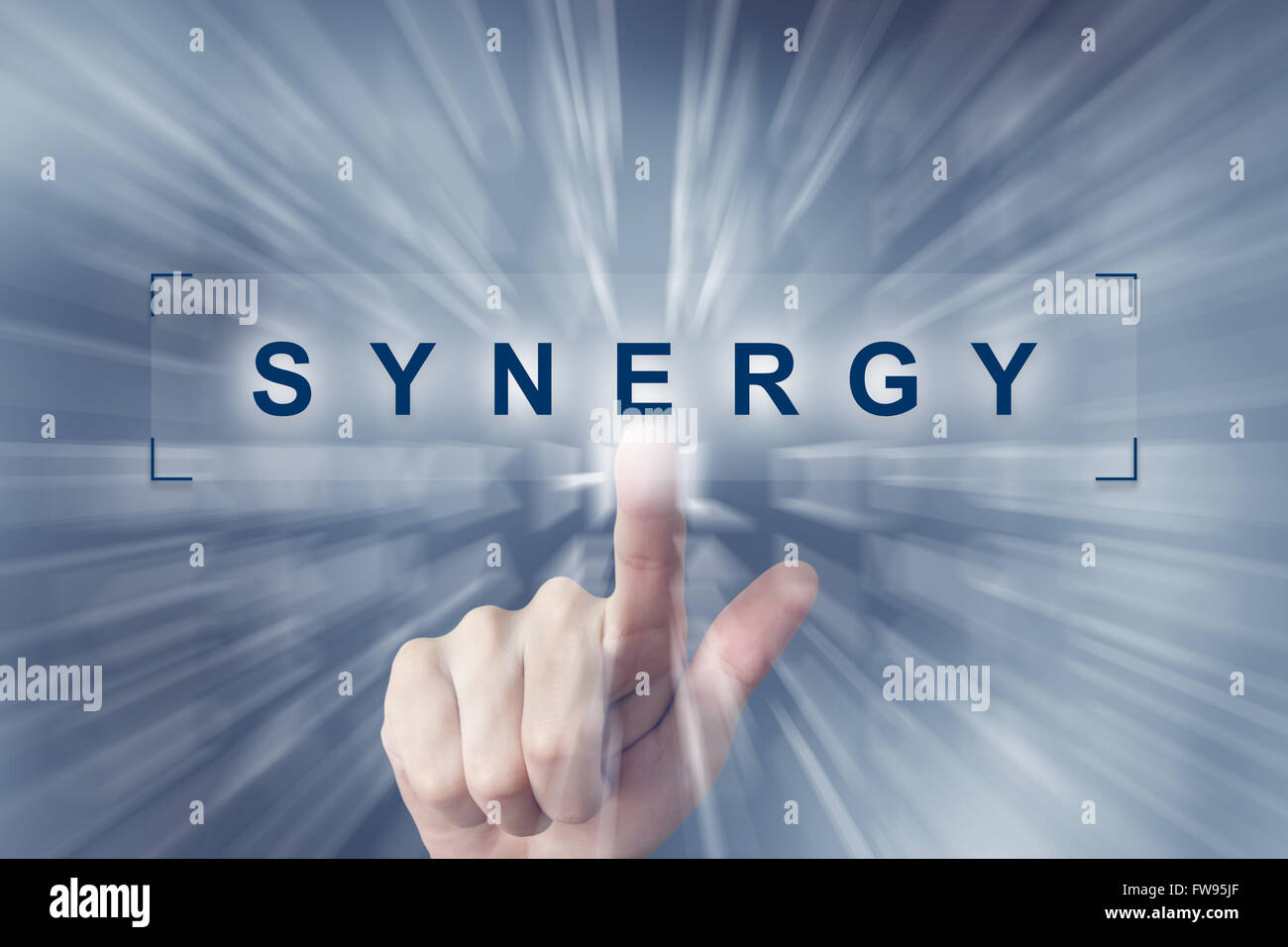 hand clicking on synergy button with zoom effect background Stock Photo