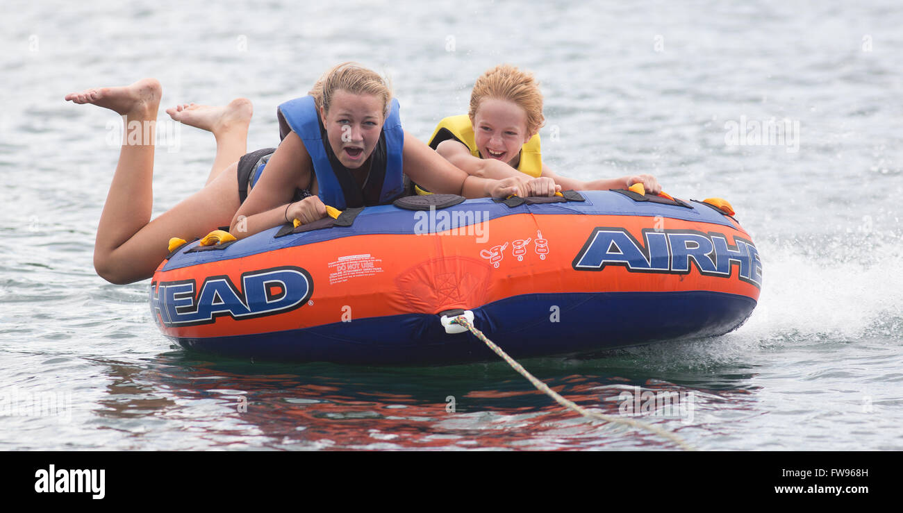 Tubing on Lake Jocassee during pontoon boat tour of the waterfalls in