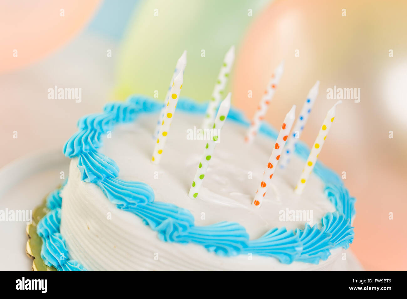 Simple white Birthday cake with cake candles Stock Photo - Alamy