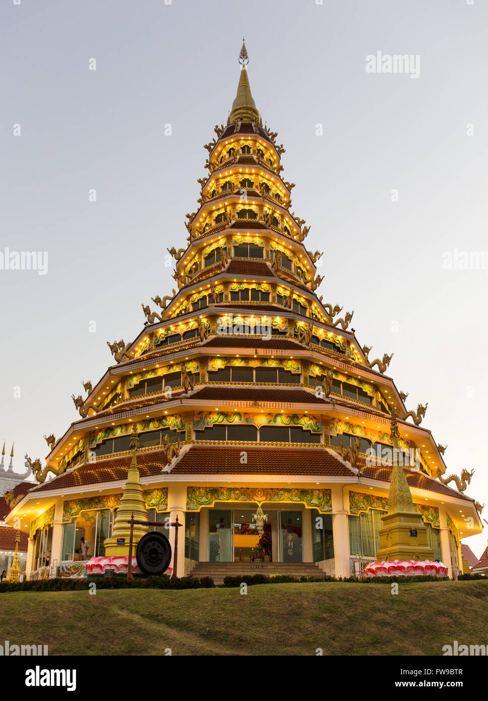 Illuminated nine-story pagoda of the Wat Huay Pla Kang temple, Chiang Rai Province, Northern Thailand, Thailand Stock Photo