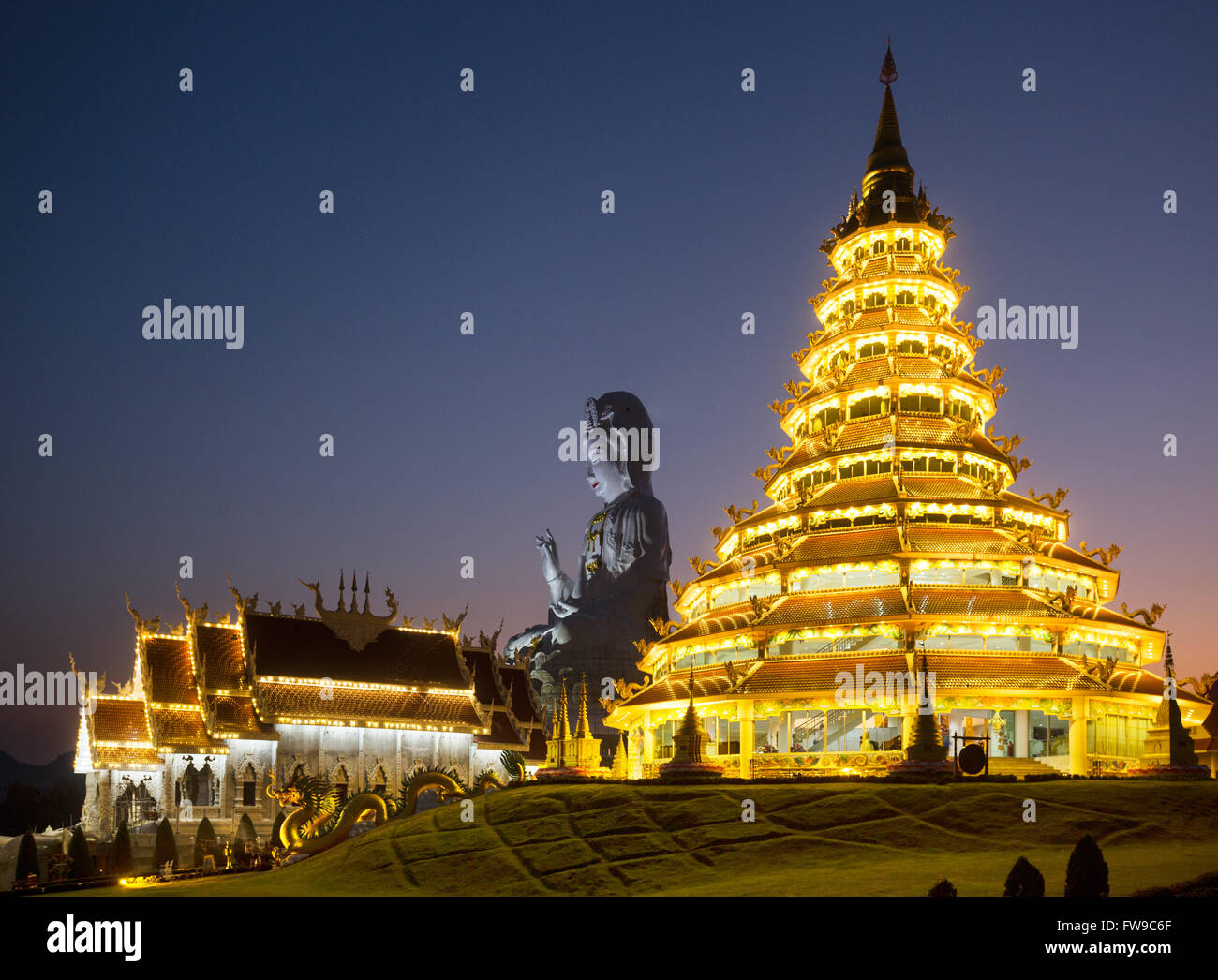 Illuminated Wat Huay Pla Kang temple at dusk, giant Guan Yin statue, Kuan Yin, Chiang Rai Province, Northern Thailand, Thailand Stock Photo