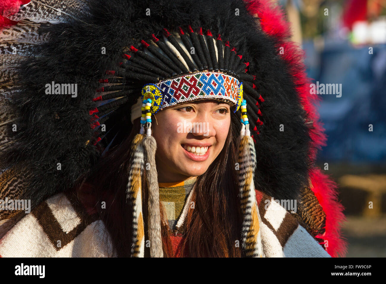 Young Asian woman with Indian jewelry at a festival with headdress, Chiang Rai Festival, Chiang Rai Province, Northern Thailand Stock Photo