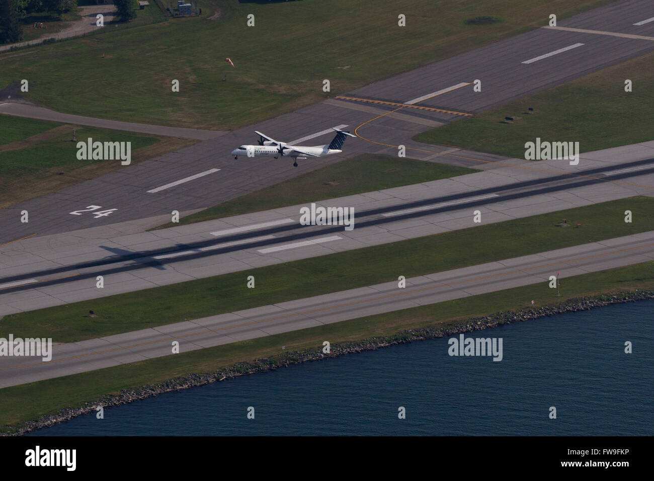 A Porter airplane is taking off from the tarmac at Billy Bishop Toronto Island airport Toronto Ont., on Wednesday Jul. 29, 2015. Stock Photo