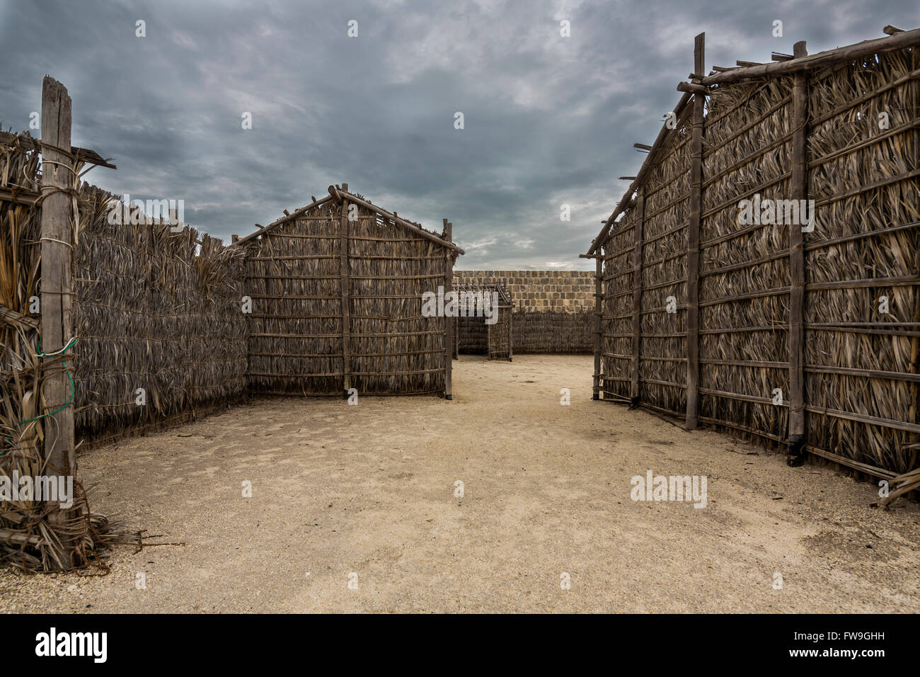 arish or barasti huts, Qal'at al-Bahrain, also known as the Bahrain Fort Stock Photo