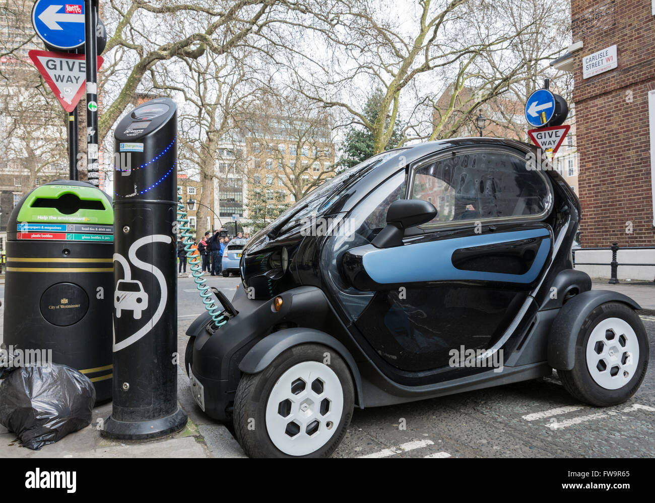 A Renault Twizy electric smart car on charge at a rapid charging point in London's Soho. Stock Photo