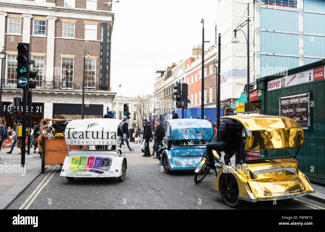 Brightly coloured rickshaws parked in a side street off Oxford Street, West End, London, England, U.K Stock Photo