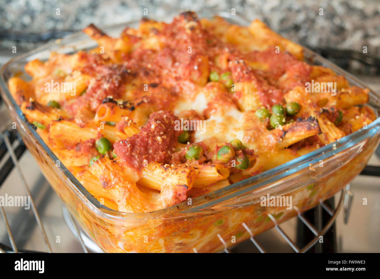 meaty baked rigatoni with peas bolognese ragout mozzarella and cheese