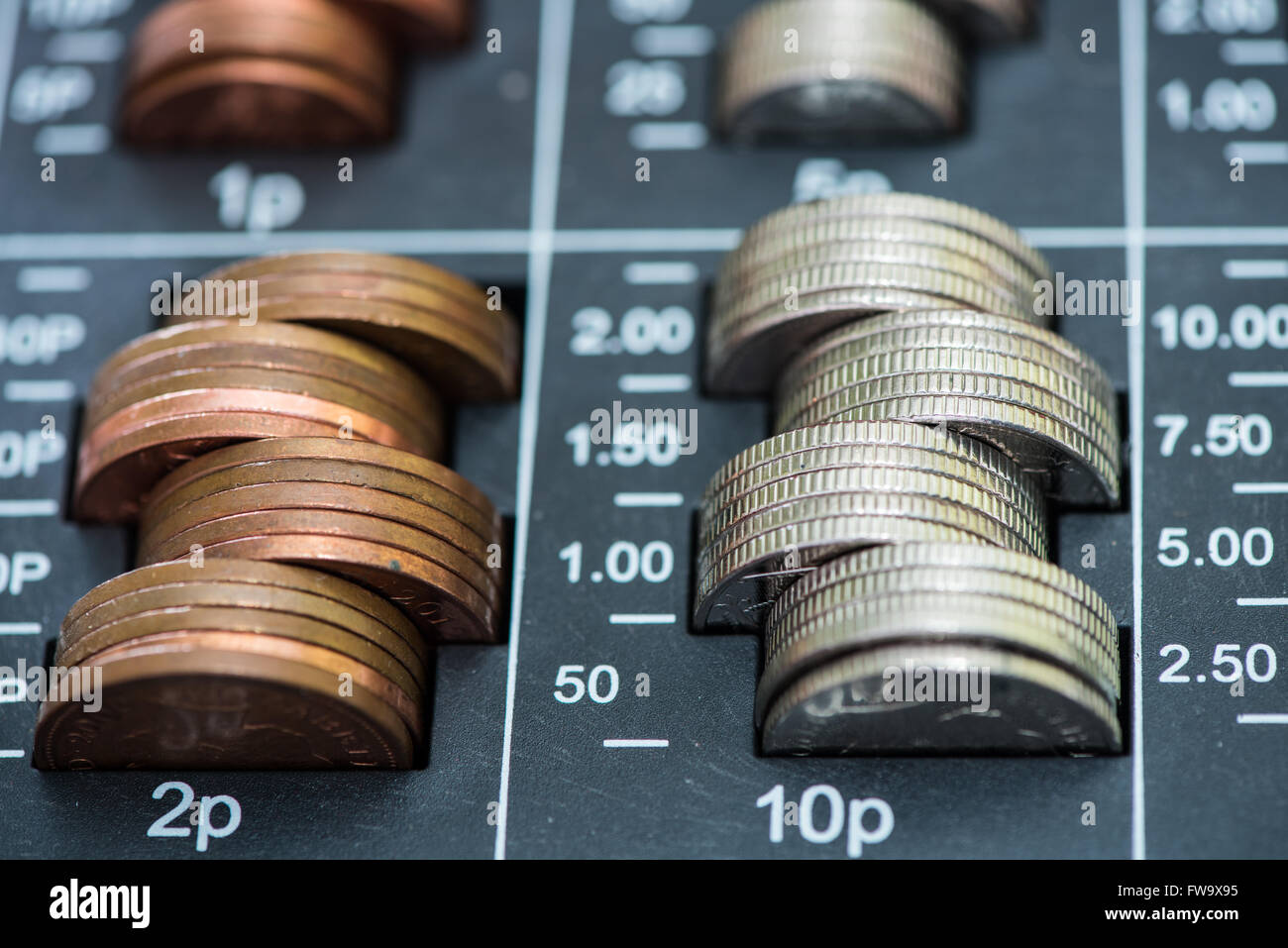 Pile of coins in cash register, british pounds sterlings Stock Photo