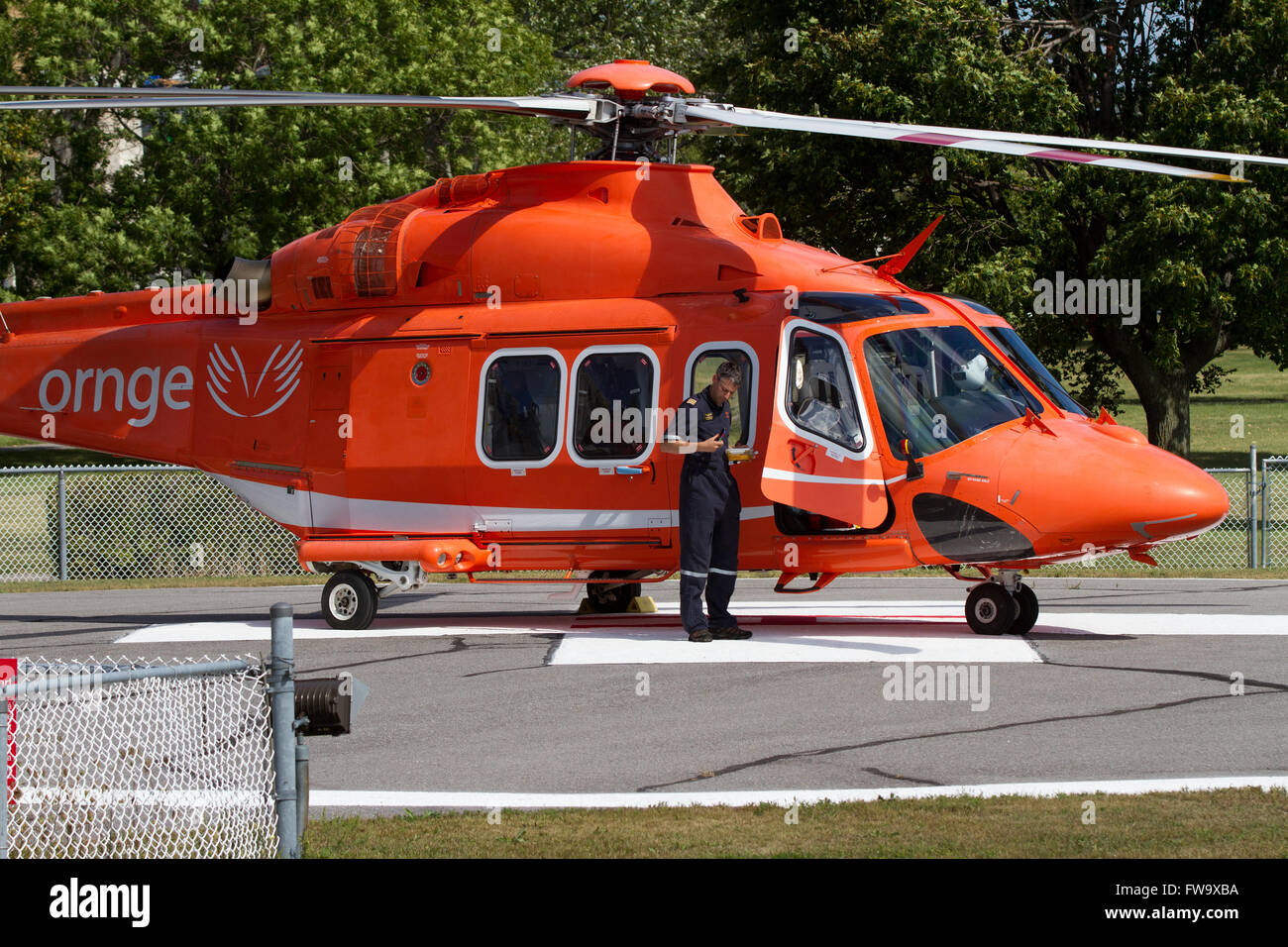 An Ornge air ambulance stands on a helipad near Kingston General Hospital(KGH) in Kingston Ont., on Thursday Aug. 14, 2015. Stock Photo