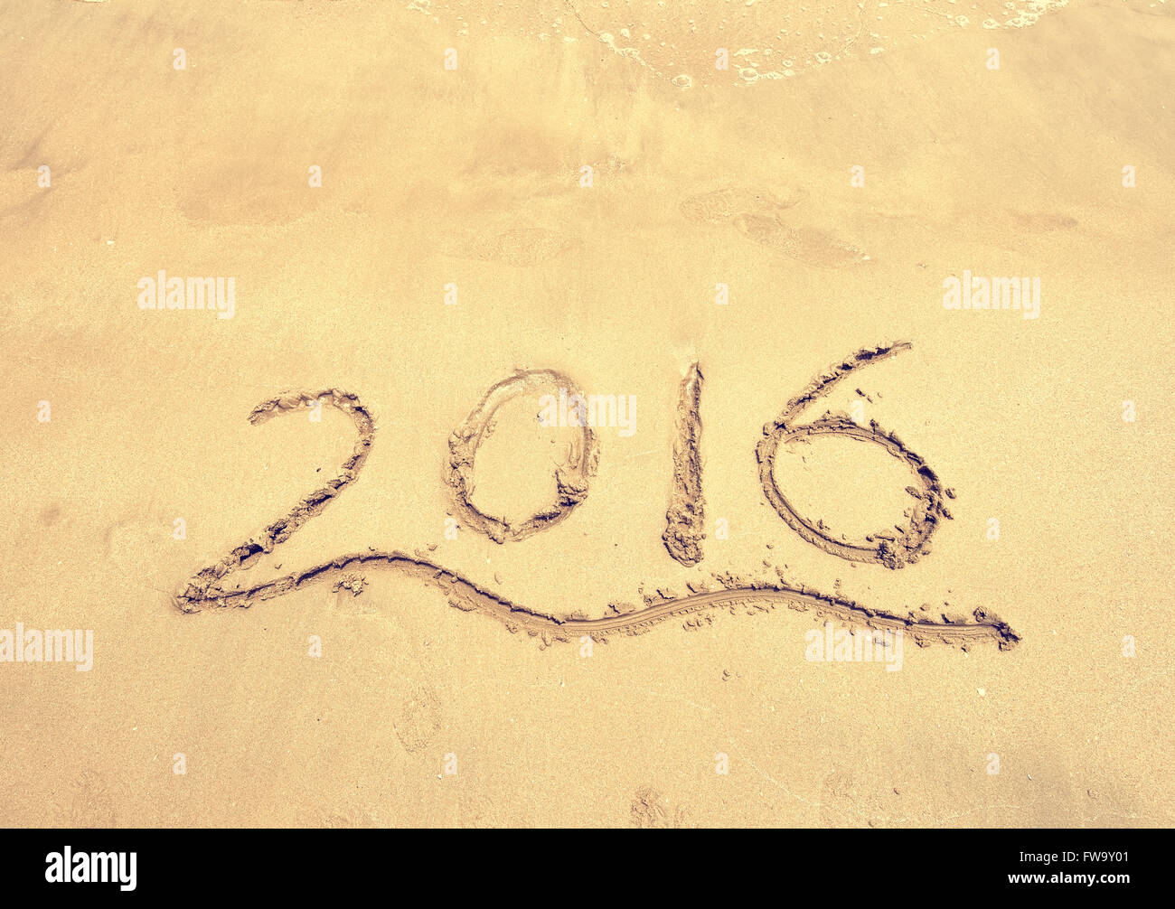 2016 written in sand, on tropical beach Stock Photo