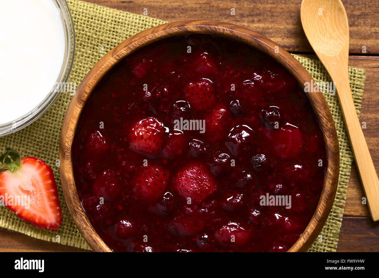 German Rote Gruetze (red groats) red berry pudding made of strawberry, blueberry, raspberry and redcurrants Stock Photo