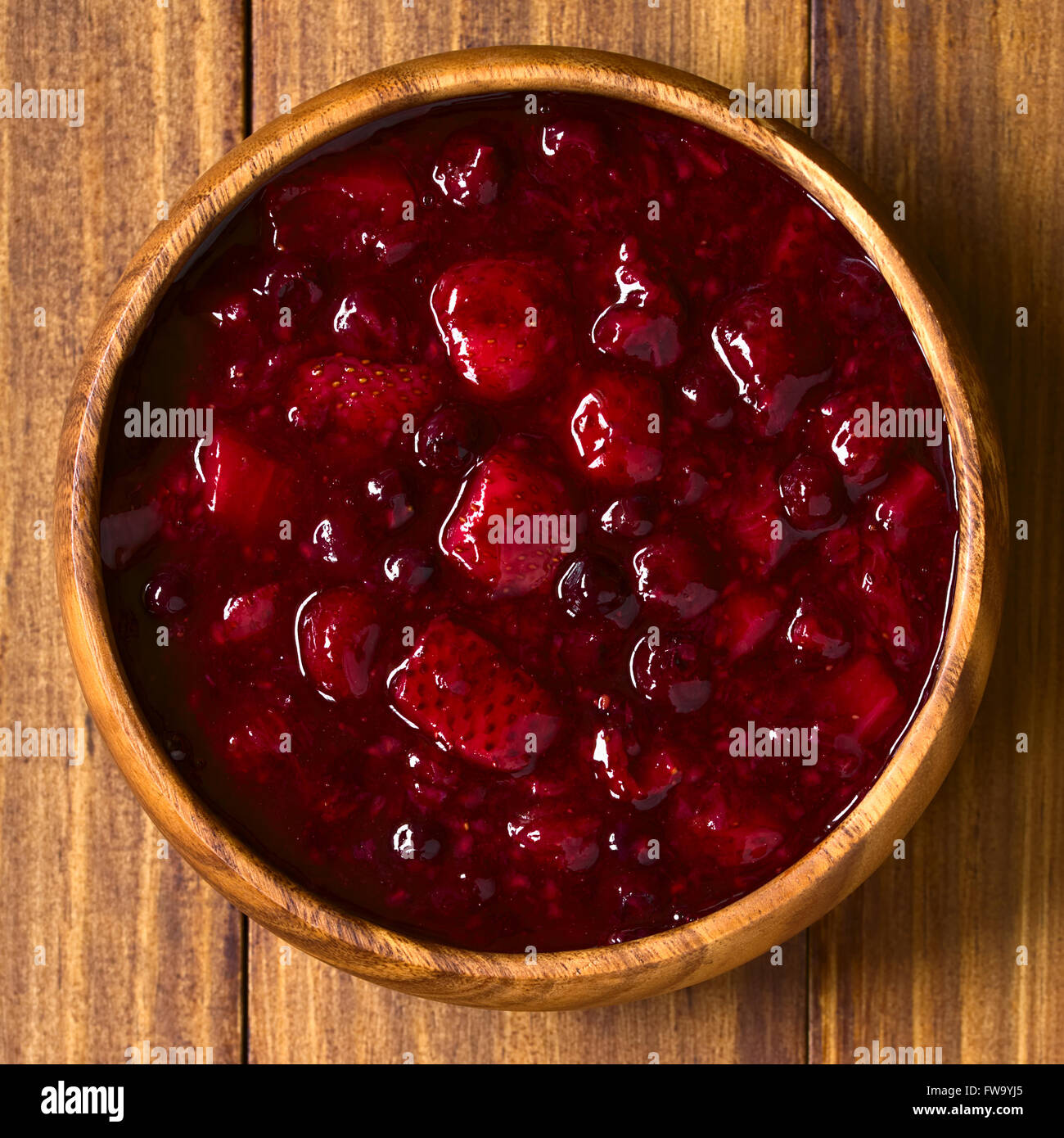 German Rote Gruetze (red groats) red berry pudding made of strawberry, blueberry, raspberry and redcurrants Stock Photo