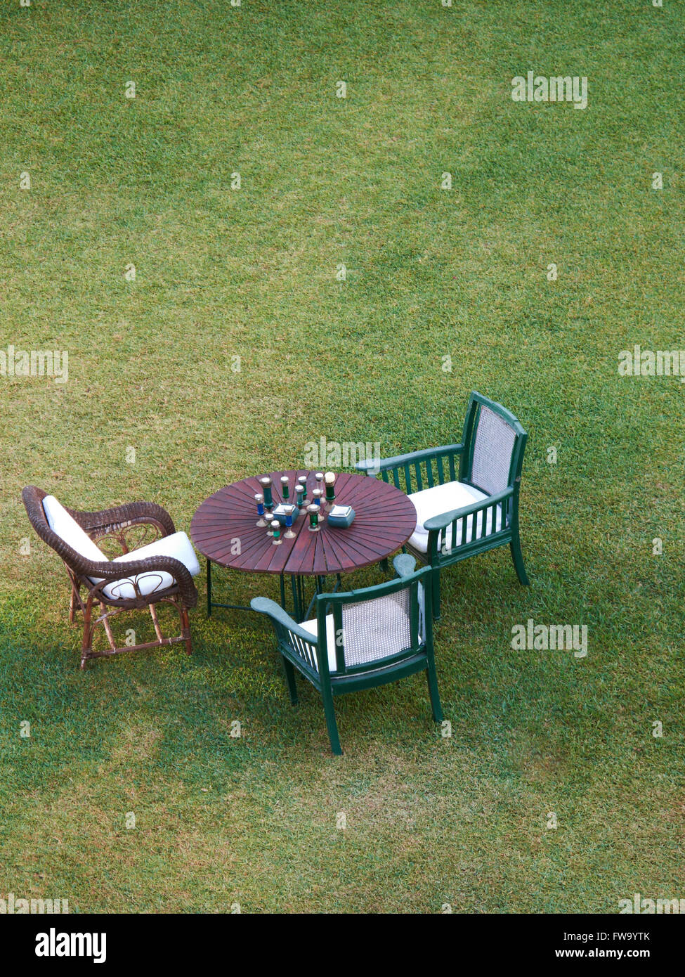 Table and chairs in the park. Vertical format Stock Photo