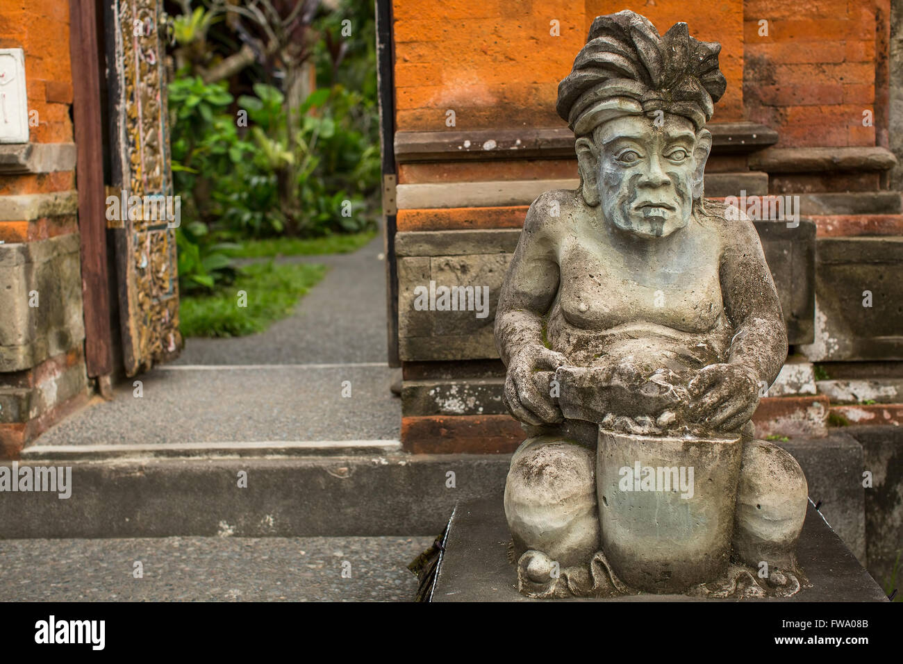 Traditional demon guard statue carved in stone on Indonesia Stock Photo ...