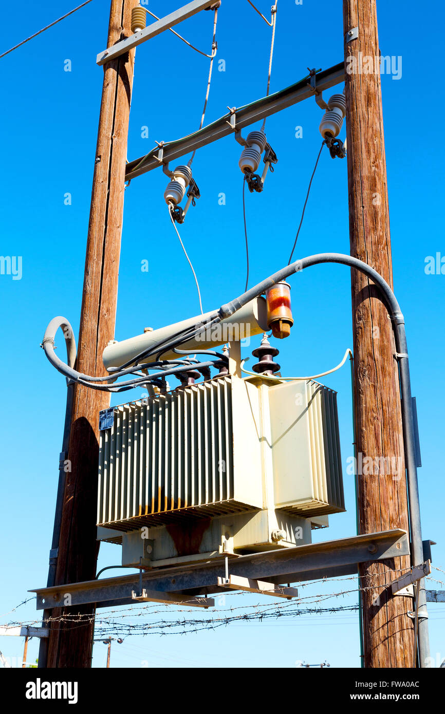 wood pylon energy and current line in oman the electric cable Stock