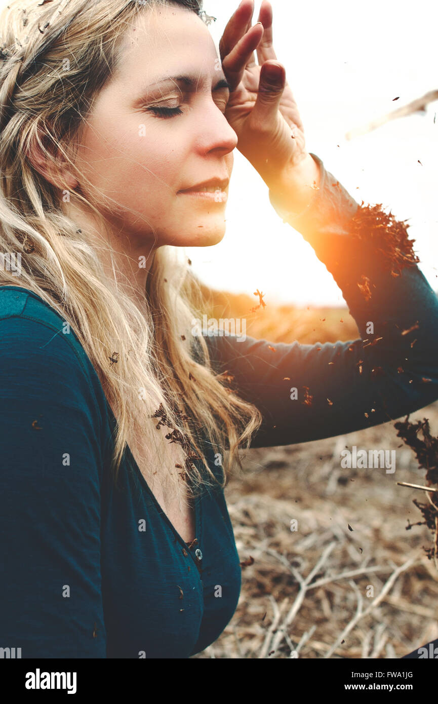portrait of the young beautiful woman dreaming in nature Stock Photo