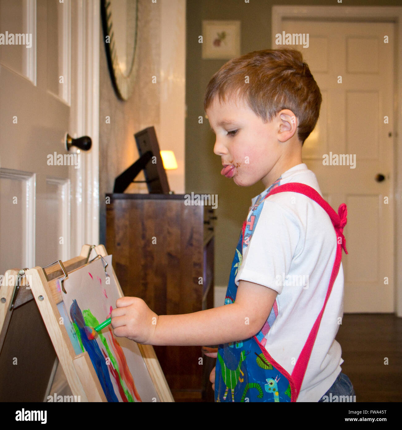 Child of 3 years old painting Stock Photo