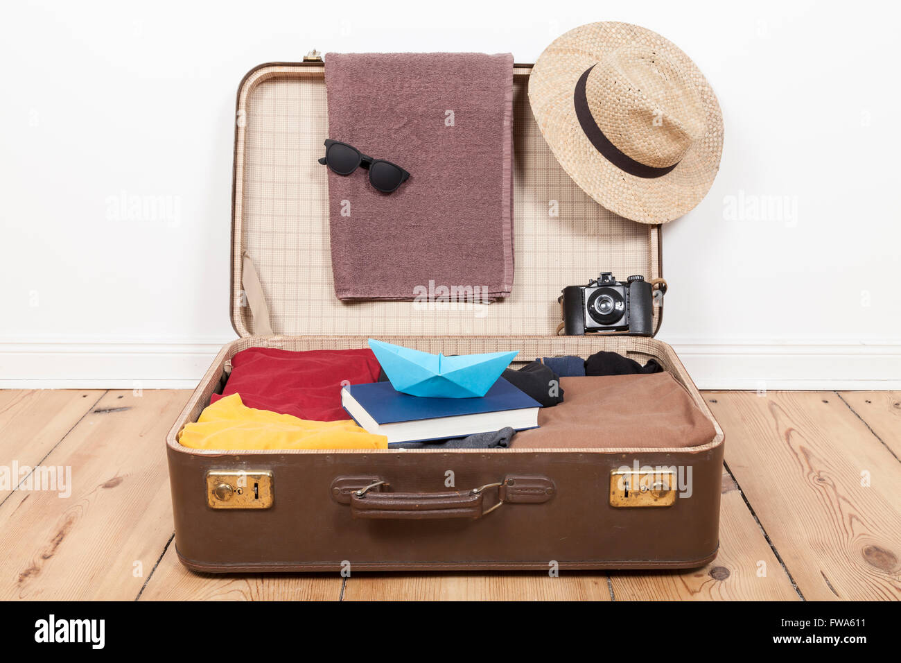 Suitcase with menswear Stock Photo