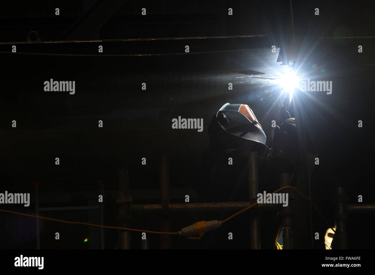 Worker welding using welding tools Stock Photo - Alamy