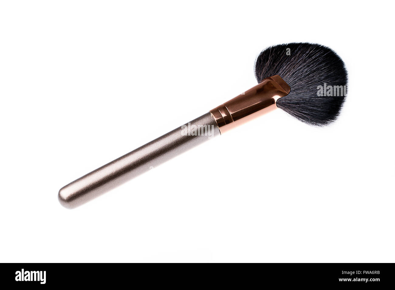 fan brush for make-up, to complete make up, dismiss cosmetics scaterred on the cheeks Stock Photo