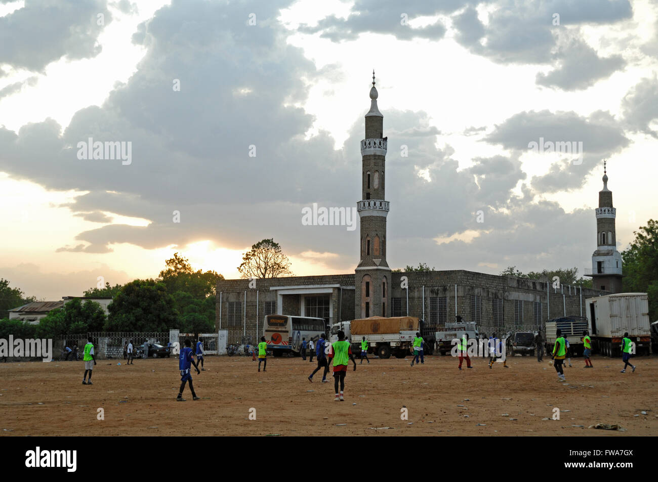 Youngsters playing football, by Mosque, in Juba, South Sudan. Stock Photo