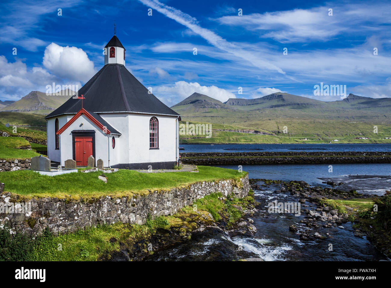 Small village church with cemetery in Faroe Islands, Denmark Stock Photo