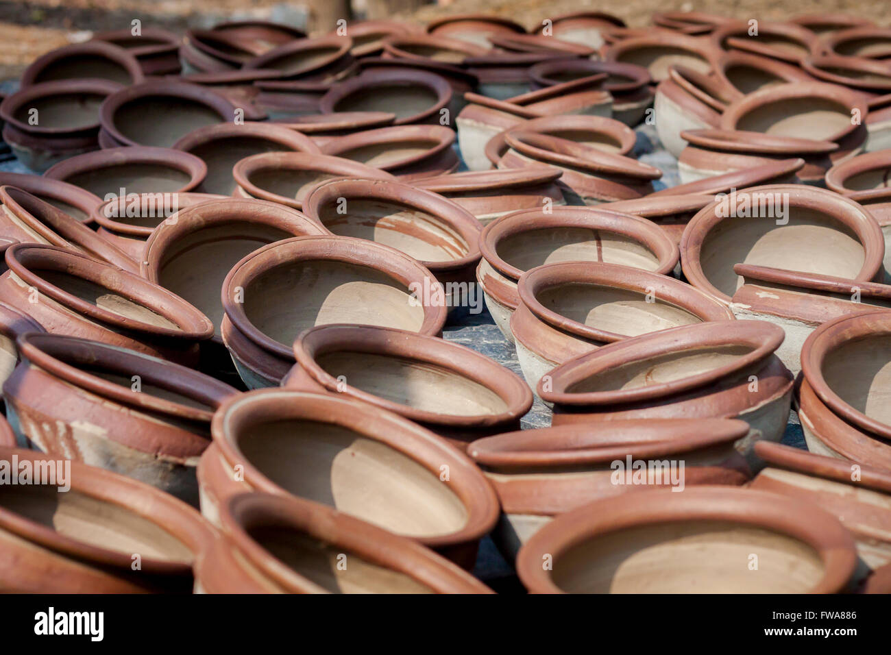 Potter making them pots using clay near of Gazipur, Dhaka, Bangladesh