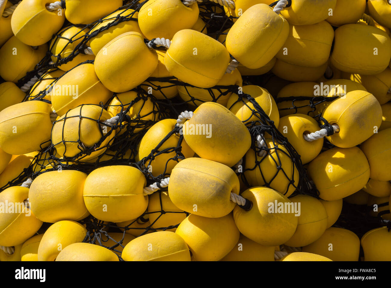 Yellow jumbo fishing floats Stock Photo Alamy