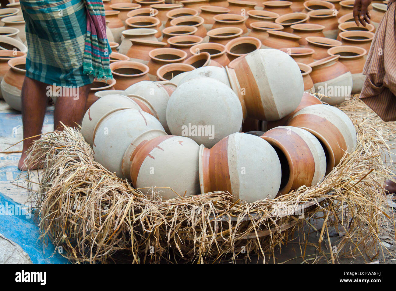 Potter making them pots using clay near of Gazipur, Dhaka, Bangladesh