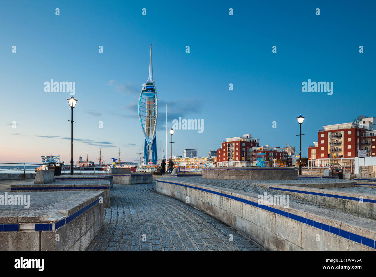 Night falls in Portsmouth, UK. Spinnaker tower in the distance. Stock Photo