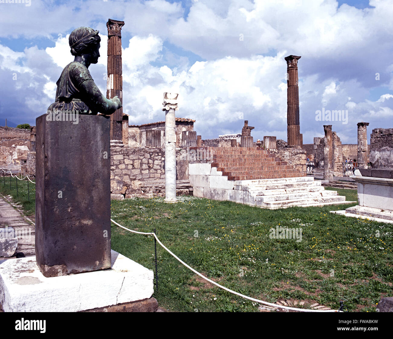 View of the Temple of Apollo with a statue in the foreground, Pompeii, Campania, Italy, Europe. Stock Photo