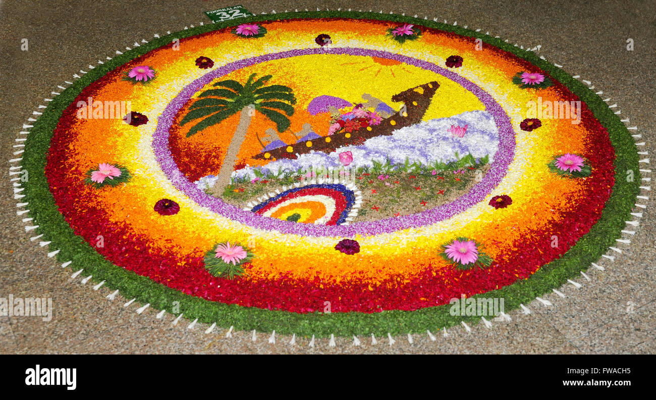 Pookalam ( floral carpet ) or floral designs are an integral colorful. Floral decorations - during Onam festival in kerala Stock Photo