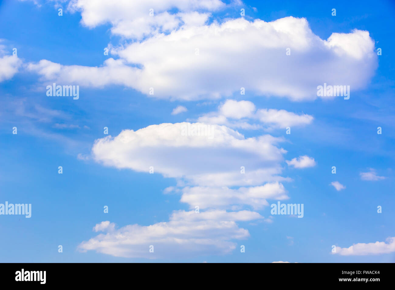 Clouds fly in light blue hi-res stock photography and images - Alamy