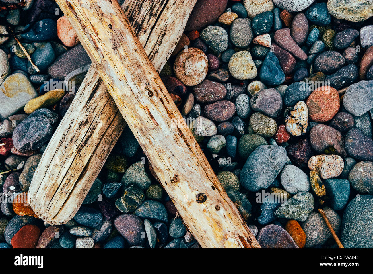 Colorful Stones and Driftwood Stock Photo