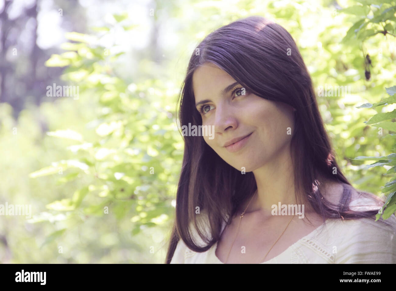 Portrait of a beautiful woman in spring park Stock Photo - Alamy