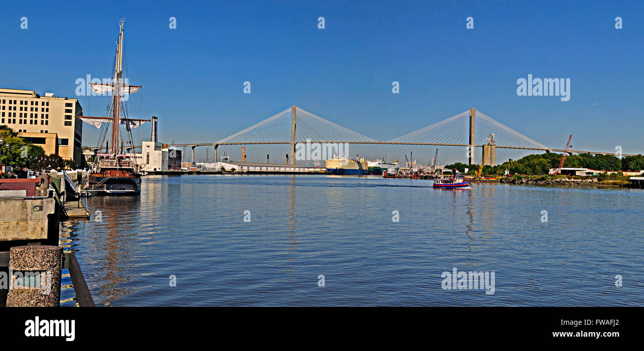 Savannah Georgia riverfront showing the Talmadge bridge, passenger ferry, old schooner and the container port. Stock Photo