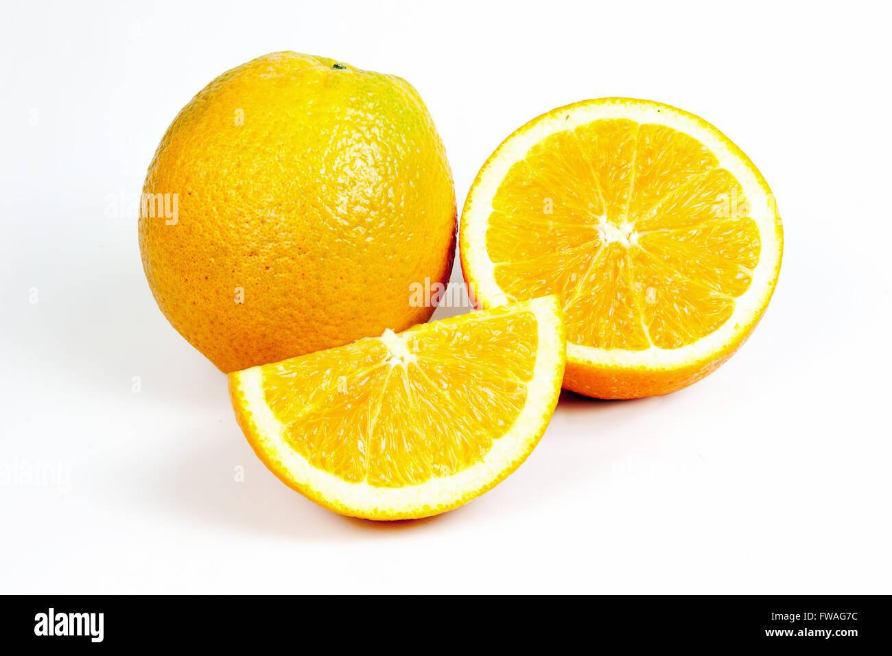 Orange fruit split on isolated white with clipping path Stock Photo