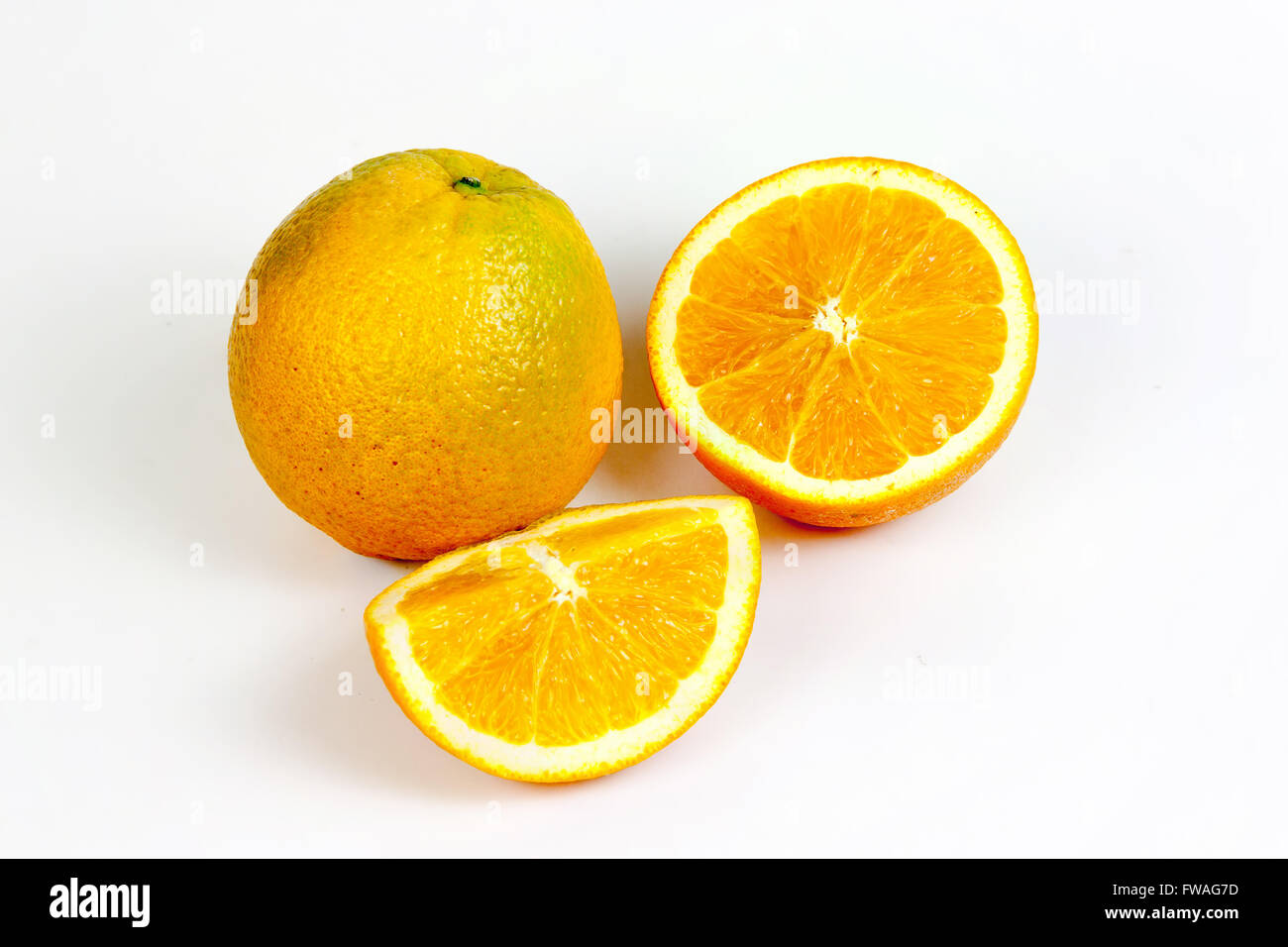 Orange fruit split on isolated white with clipping path Stock Photo