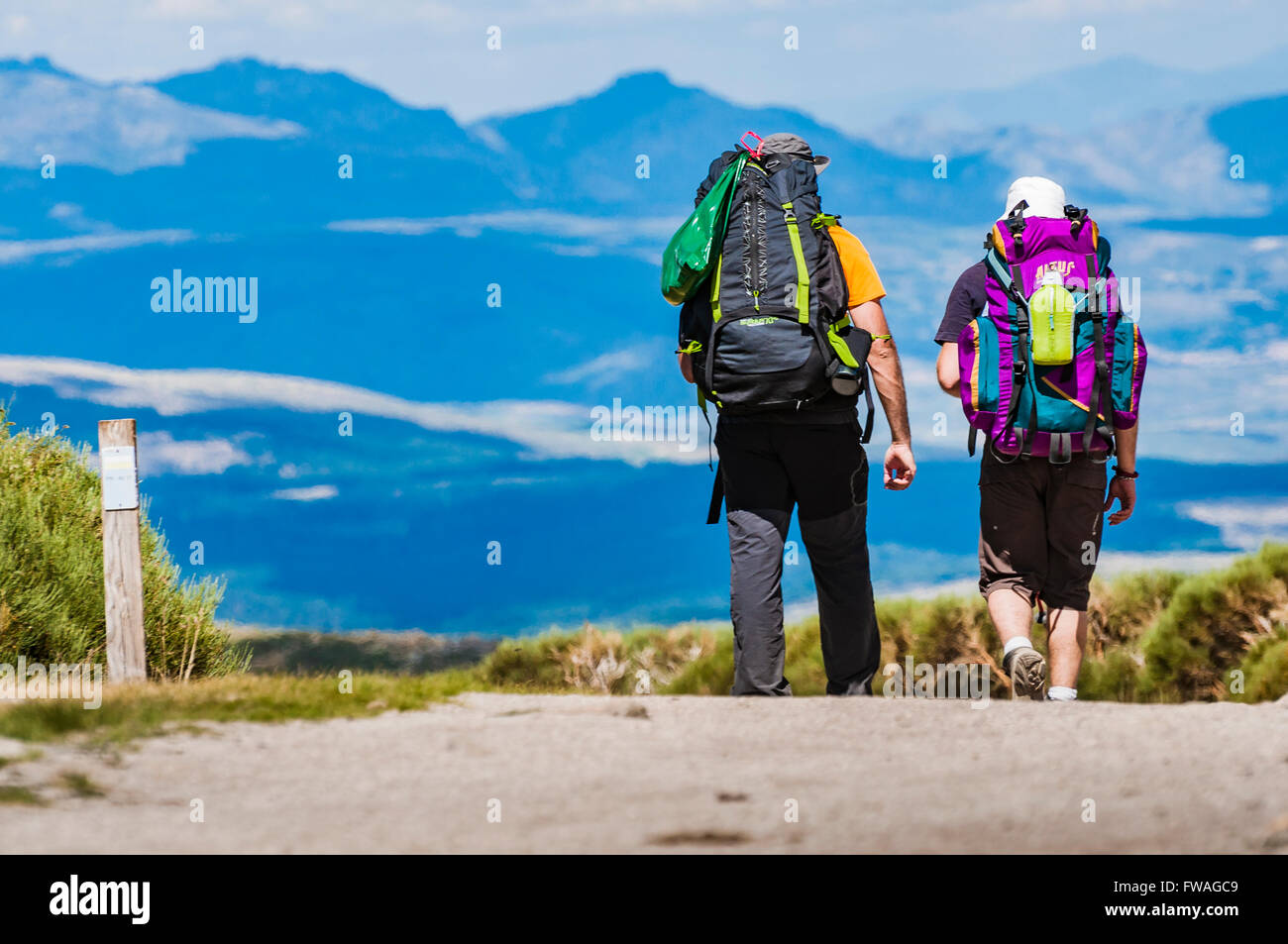 Hikers on the path to the Cirque de Gredos. Hoyos del Espino, Ávila, Castilla y León. Spain, Europe Stock Photo