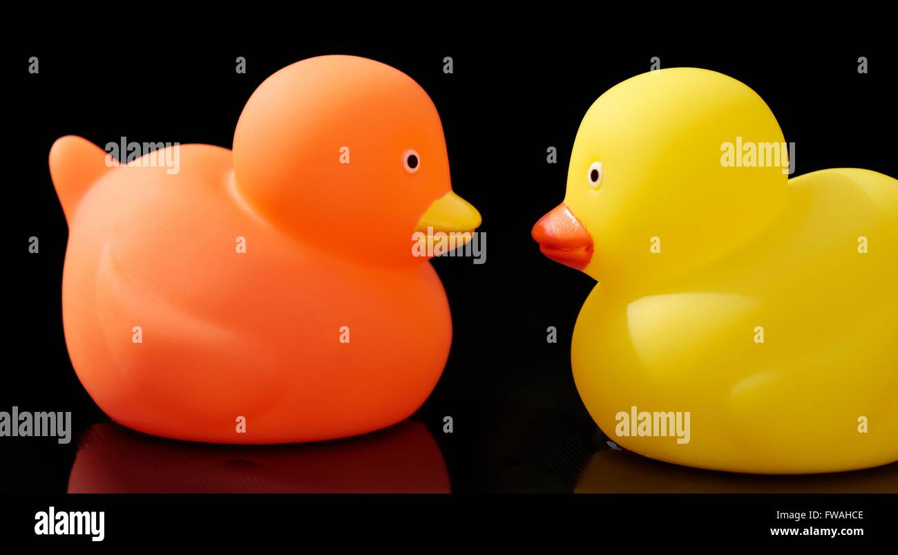 Orange and yellow toy ducks face to face Stock Photo Alamy