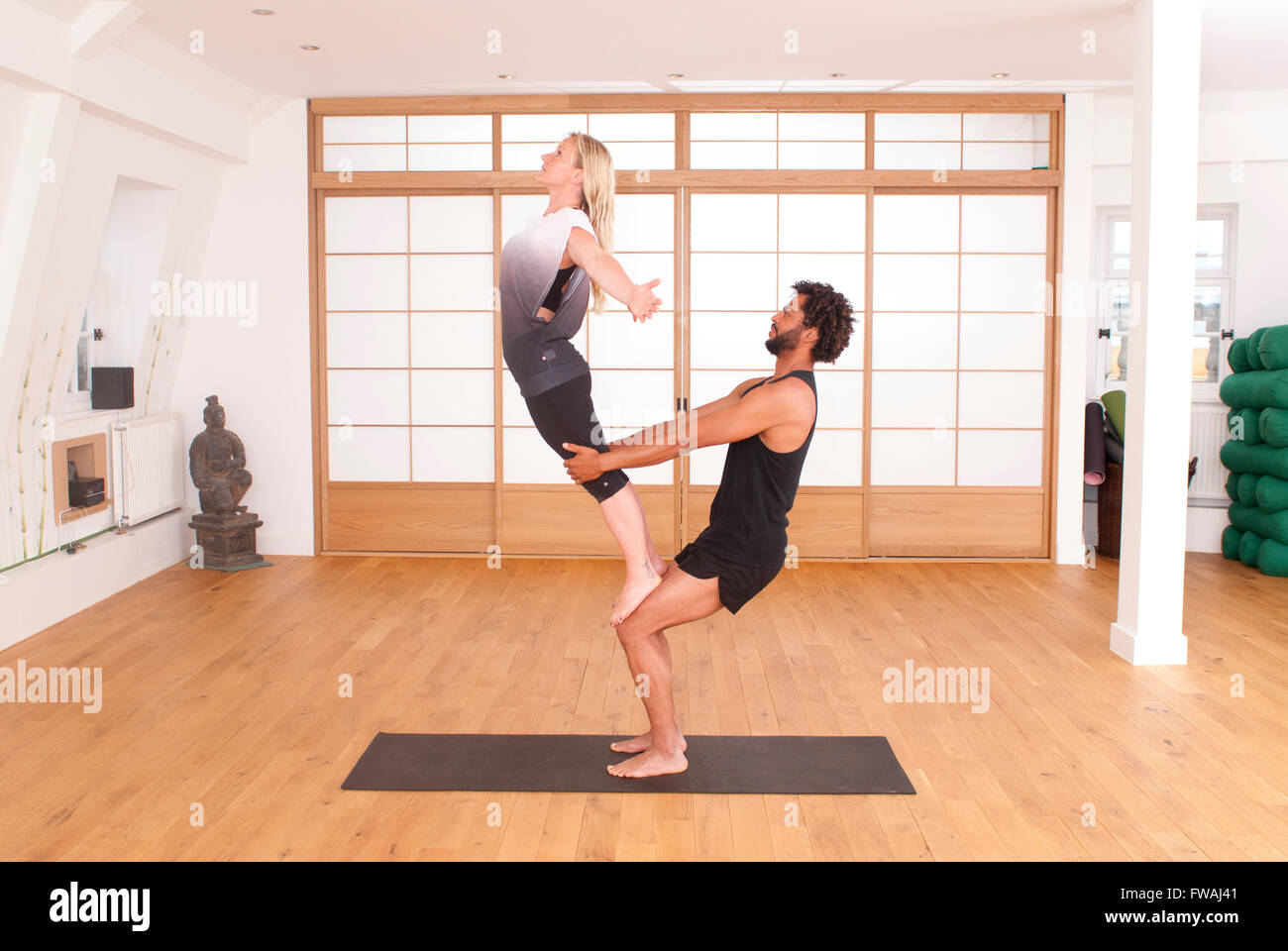 Acro Yoga teaching through demonstration Stock Photo