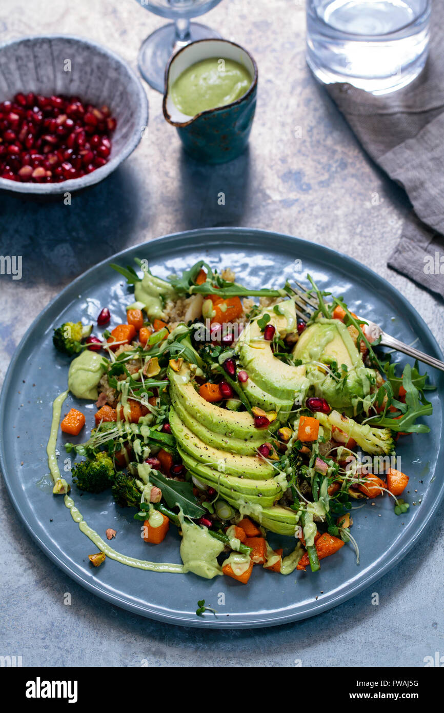 Healthy vegetarian salad with quinoa, butternut squash and avocado Stock Photo