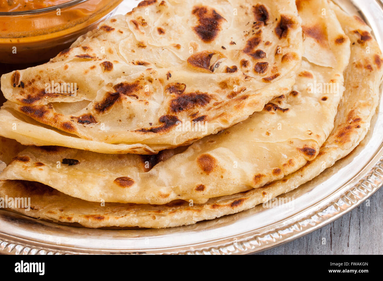 Indian layered Paratha roti kerala porotta with chicken 