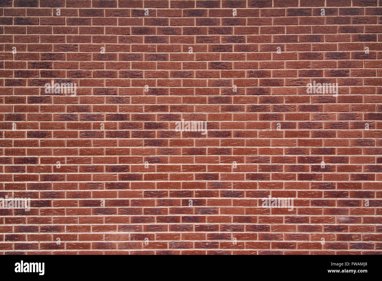 Exposed red vintage brick wall texture, brickwork pattern as background Stock Photo