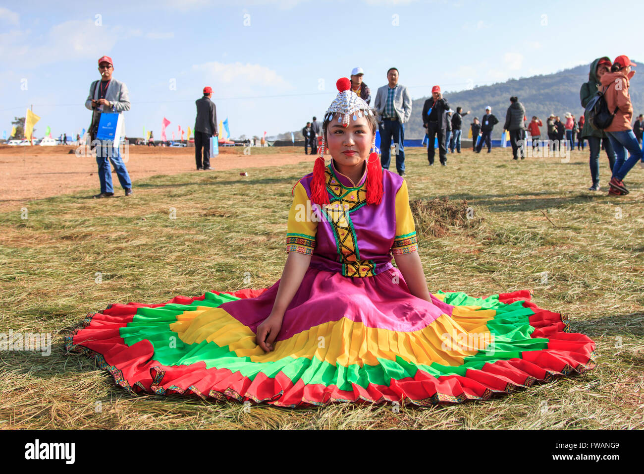 Heqing, China - March 15, 2016: Chinese girl in traditional Chinese clothing during the Heqing Qifeng Pear Flower festival Stock Photo