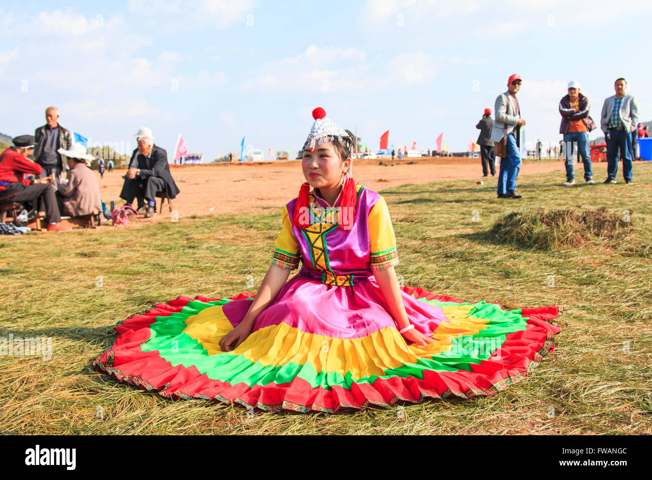 Heqing, China - March 15, 2016: Chinese girl in traditional Chinese clothing during the Heqing Qifeng Pear Flower festival Stock Photo