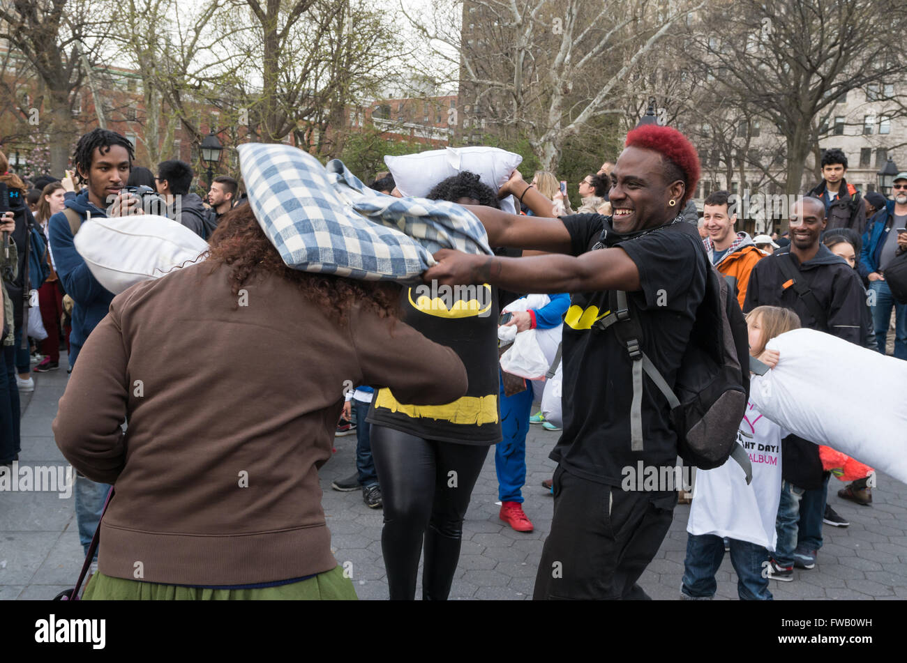 Young man hits woman round the hit with a pillow during the worlds